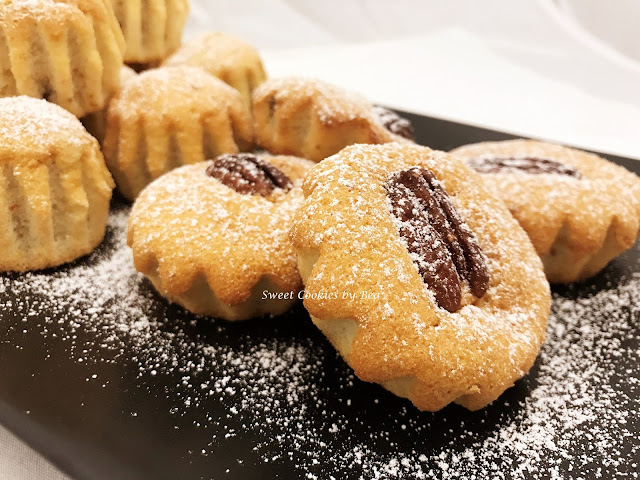 Bizcochitos de claras aromatizados con naranja y pecanas